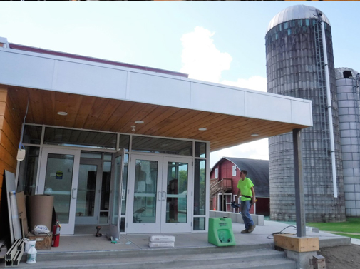 The entrance to Weston Playhouse’s second stage, now under construction, sits next to the silos of the Walker Farm on Route 100. Photo by Kevin O’Connor/VTDigger